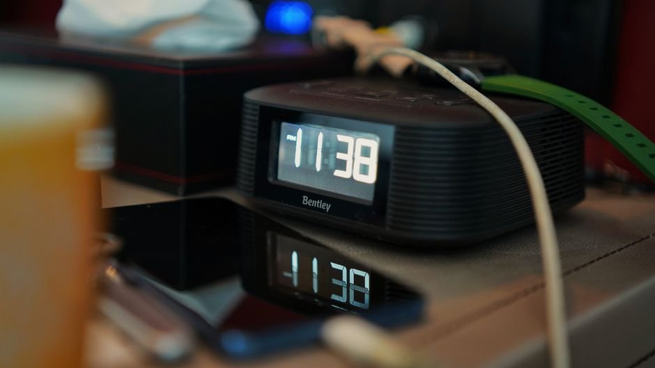 A digital alarm clock displaying 11:38, relevant for ADHD forgetfulness solutions.