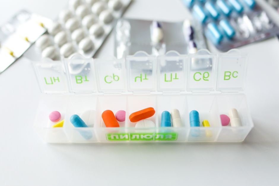 A pill organizer filled with various medications, illustrating effective medication reminders.