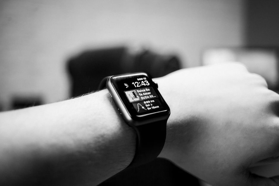 A smartwatch on a wrist showing notifications, related to setting up alerts.