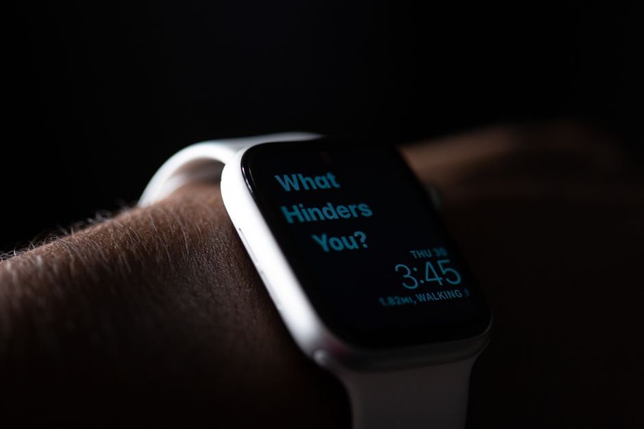 A wristwatch displaying the time and a motivational message, related to vibrating wrist alarms.
