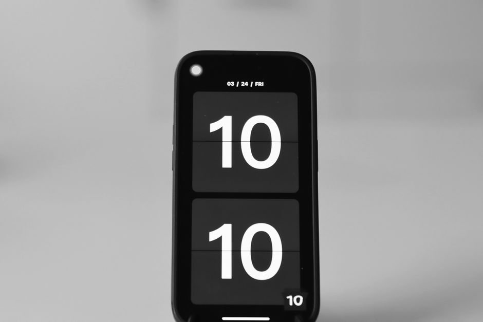 A portable digital clock showing the time 10:10, relevant to best portable digital clocks.