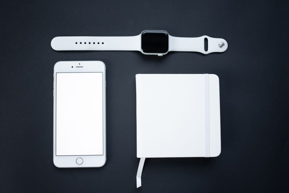 A smartphone, smartwatch, and notebook illustrating syncing reminders across devices.